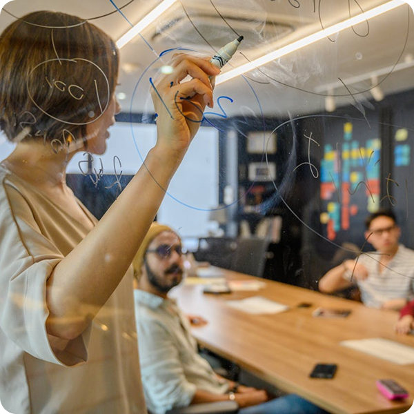 Team member pointing at board